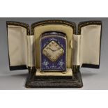 A continental silver and lilac enamel miniature timepiece,