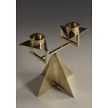 An Elizabeth II Modernist two-light candelabrum, cylindrical sconces, triform drip-pans,