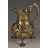 A Victorian silver bellied cream jug, chased with flowers and scrolls, double scroll handle,