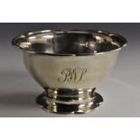 A George V silver shaped circular pedestal bowl, spreading foot, 13cm diam, Aitken Brothers,