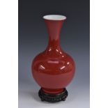 A Chinese monochrome ovoid vase, red glaze, flared rim, 24.