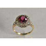 A spinel and diamond cluster ring, central rose pink spinel approx 1.