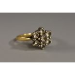 A diamond floral cluster ring,