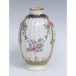 A Worcester fluted ovoid tea canister, painted with garlands of garden flowers within three panels,