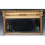 A Regency giltwood and gesso breakcentre over mantel looking-glass,