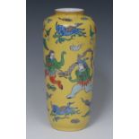 A Chinese slender ovoid vase, decorated and incised in colourful polychrome with acrobats,