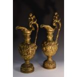 A pair of large 19th century gilt bronze ewers,