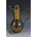 An 18th century Continental silver baluster water jug, raised cover,