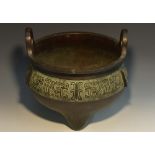 A large Chinese patinated bronze ding censer, cast in the archaic manner,