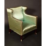 *Withdrawn* An early 20th century wing back side chair, upholstered in green silk,