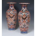 A pair of Japanese Imari baluster vases,decorated with mons and phoenix, 44cm high,