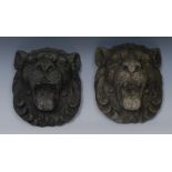 A pair of 18th century style composition bosses, as lion masks,