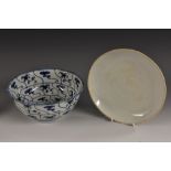 A Chinese bowl, painted in underglaze blue with scrolls within wavy panels, 18cm diam,