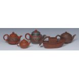 A Chinese Yixing terracotta teapot, modelled as a sampan,