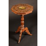 A Black Forest octagonal tripod occasional table,