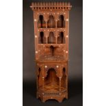 A Moorish hardwood floor standing corner cabinet,