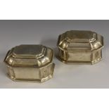 A pair of 18th century German silver canted rectangular table spice boxes, hinged raised covers,
