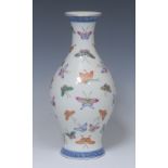 A Chinese baluster vase, decorated in polychrome with a profusion of butterflies,