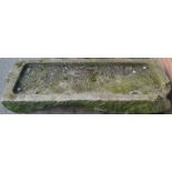 A 19th century gritstone sink, of shallow proportions,