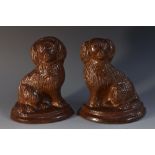 A pair of 19th century Brampton brown salt glazed stoneware spaniels, as bookends/door stops,