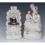 A 19th century Staffordshire clock figure group, of John Wesley preaching from the pulpit,