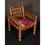 A 19th century Indian penwork chair, spindle back and arms, turned legs,