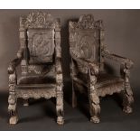 A pair of 19th century Jacobethan oak baronial armchairs,