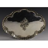 An Edwardian silver quatrefoil dressing table tray,