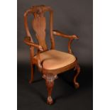 A George I Revival walnut armchair, retailed by Liberty & Co, labelled,