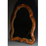 A 19th century French kingwood shaped oval easel dressing mirror, gilt metal beaded bezel,