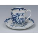 A Worcester Mansfield pattern coffee cup and saucer, painted with the scrolling foliage,