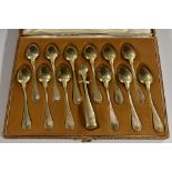 A set of twelve French silver-gilt teaspoons, tongs ensuite, Emile Puiforcat, Paris, c.