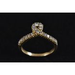 A diamond loop ring, single loop crest, linear set with eighteen round cut diamonds,