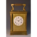 An early 20th century French carriage clock, 5cm white enamelled dial,