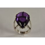 A large amethyst and diamond pear drop ring, pear drop amethyst measuring approx 26mm x 17mm, 10mm,