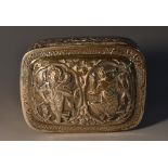 An Indian silver rounded rectangular box, profusely chased with deities,