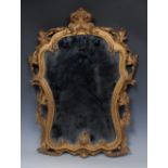 A 19th century Rococo Revival giltwood and gesso looking-glass,