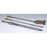 A set of George III steel and brass fire irons, comprising shovel, poker and tongs,