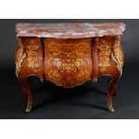 A Louis XV style gilt metal mounted kingwood and marquetry bombe shaped commode,