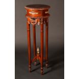 A 19th century style gilt metal mounted jardiniere stand, circular top with gadrooned border,