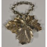 A William IV cast silver cut-out wine label, Madeira, as a vine leaf, 7cm wide, Benjamin Smith II,