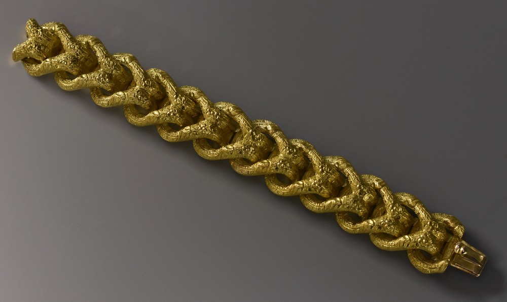 A 19th century French articulated fancy link bracelet, compression clasp,