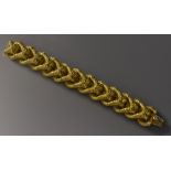 A 19th century French articulated fancy link bracelet, compression clasp,
