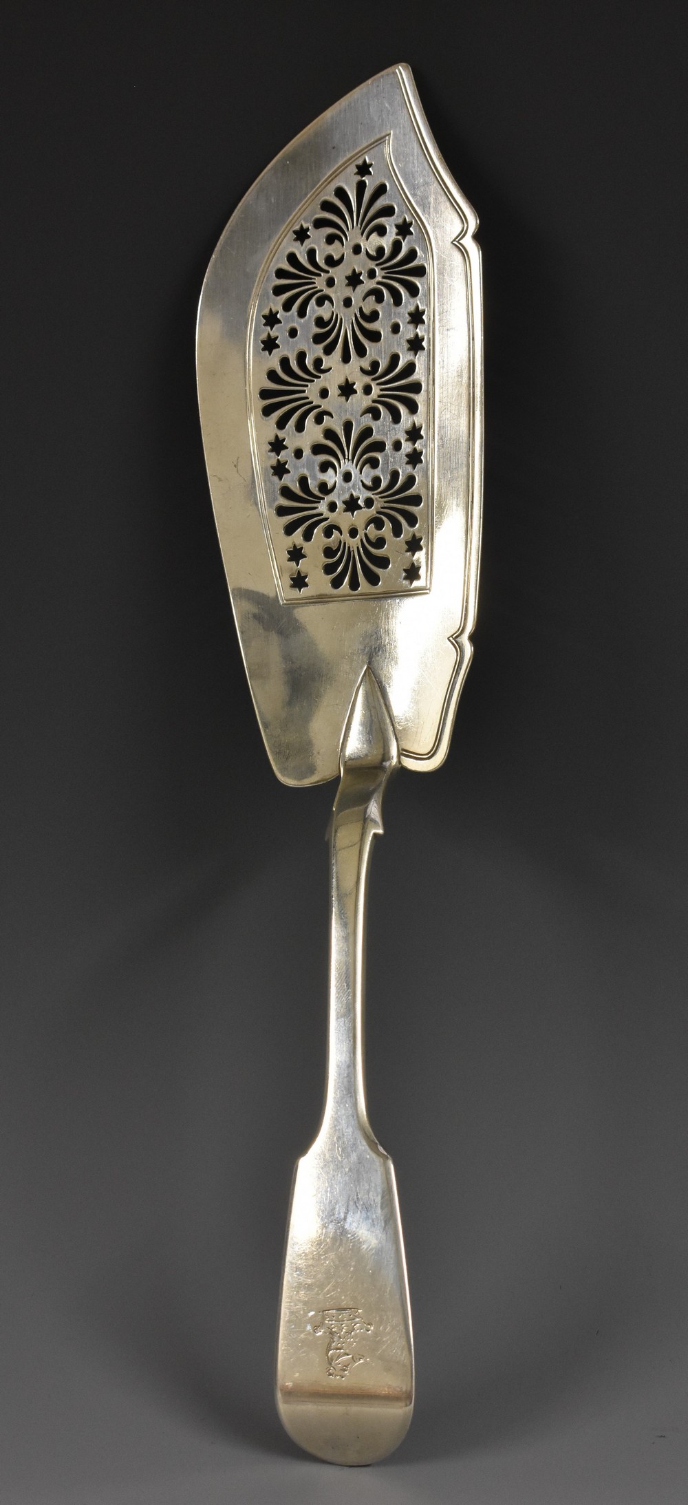 A William IV silver Fiddle pattern fish slice, shaped blade pierced with anthemions and stars,