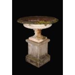 A pair of Victorian cast iron saucer-shaped garden urns, dart-and-egg frieze, fluted socles,