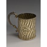 A Victorian silver cylindrical child's mug, spirally fluted and chased with sprays,