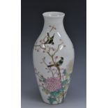 A Chinese ovoid vase, painted with song bird on chrysanthemum branches and script, 22cm high,