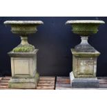 A pair of Regency design composition saucer-shaped garden urns,