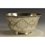 A Portuguese silver circular bowl, bright-cut engraved with swags, beaded borders, spreading foot,