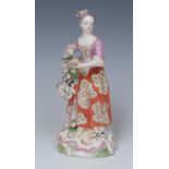 A Derby Patch Mark figure, Allegorical of Summer, of a girl holding flowers and corn,